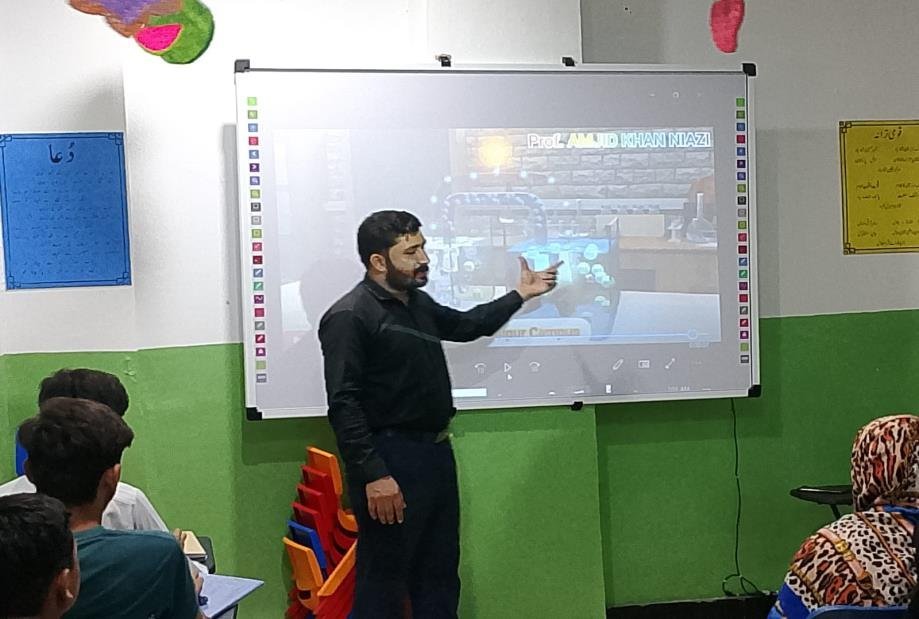 An ICC faculty member with students